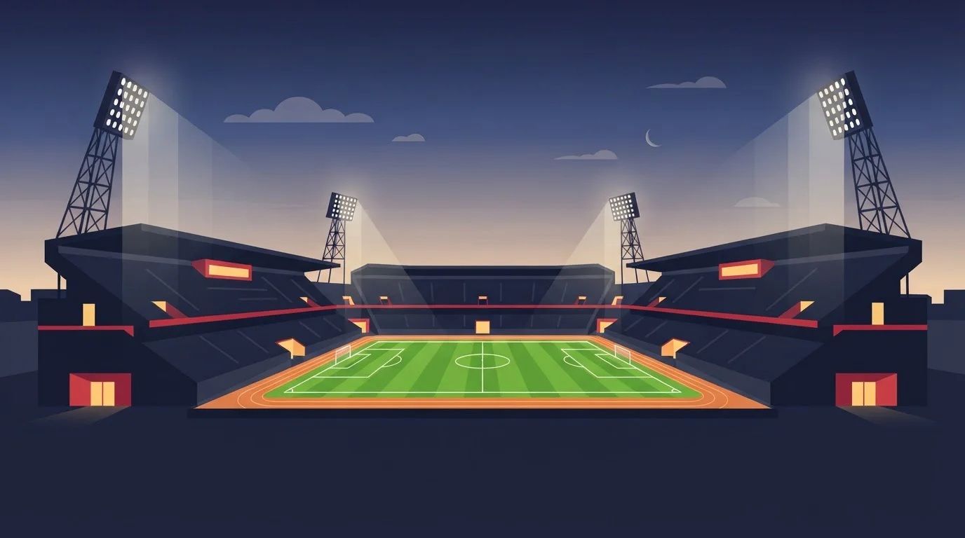 Beleuchtetes Fußballstadion am Abend mit Spielfeld und Flutlichtmasten